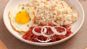 Cornsilog Filipino Rice Breakfast (Corned Beef at Sinangag na Kanin) Filipino Corned Beef with Garlic Fried Rice