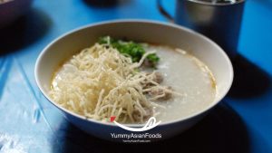 Jok (Rice Porridge, a Street Food in Thailand) Porridge with pork and egg