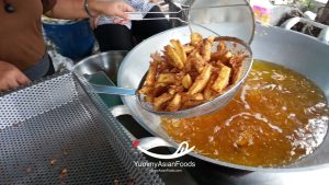 Kluay Tod Street Food in Thailand Deep-fried sweet banana coated in coconut and sesame seeds