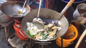 Pad See Ew Street Food in Thailand Wide rice noodles stir-fried in a sweet, dark soy sauce