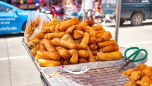 Poh Pia Tod Street Food in Thailand Spring rolls drenched in sweet chili sauce 