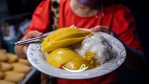 Khao Niew Ma Muang (Mango Sticky Rice Street Food in Thailand) Sweet dessert made with coconut milk