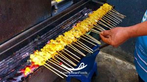 Satay Street Food in Thailand Grilled meat skewers with peanut sauce