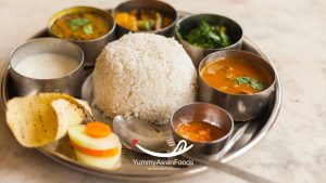 Preparing the side dishes of Nepali dal bhat