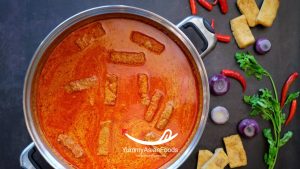 Step 3 in Cooking Singaporean Laksa Cook the broth with spices