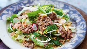 Lap Khmer A flavorful Cambodian beef salad with fresh herbs and a zesty dressing.